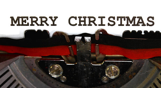 istock MERRY CHRISTMAS written with black ink with the typewriter 520792865