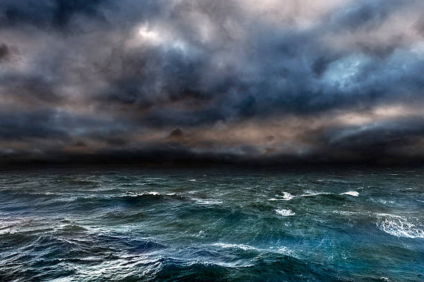 Dangerous storm over ocean Approaching storm over the ocean. tide photos stock pictures, royalty-free photos & images