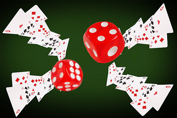 istock Playing cards and dice flying at the poker table 520794854