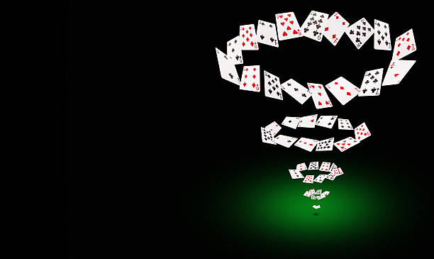 istock Playing cards flying at the poker table 520794894