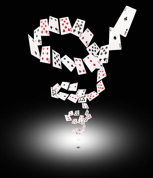 istock Playing cards flying at the poker table 520794900