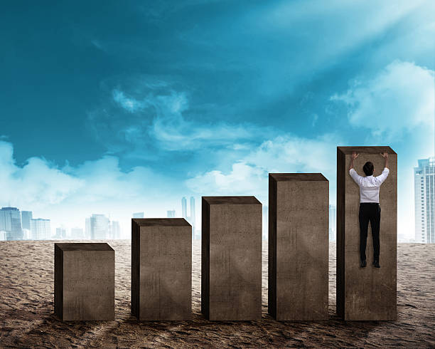 istock Asian business man hanging on the chart 520796810