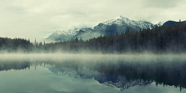 Lake Herbert Lake Herbert panorama in a foggy morning with glaciers mountain and reflection in Banff National Park, Canada yoho national park photos stock pictures, royalty-free photos & images