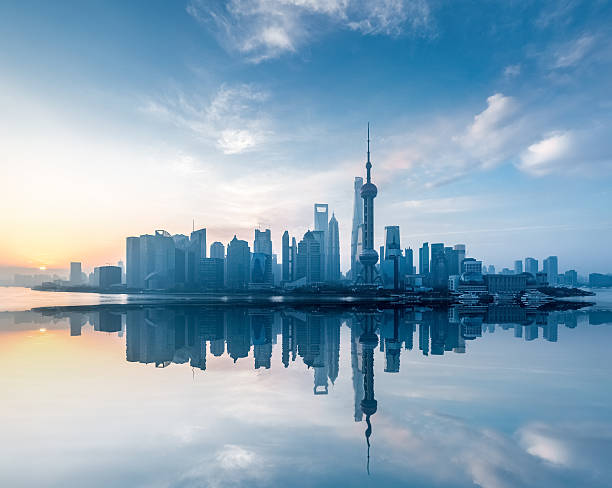 istock shanghai skyline with reflection in sunrise 520797252