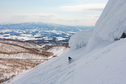 Wanaka, New Zealand – August 01, 2021: A full Saddle chair on a powder day at Treble Cone