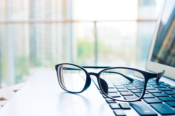istock Office desk with laptop and eyeglass 520798082