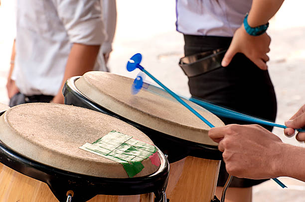 istock Percussionist slap hand on the Conga in school. 520799516