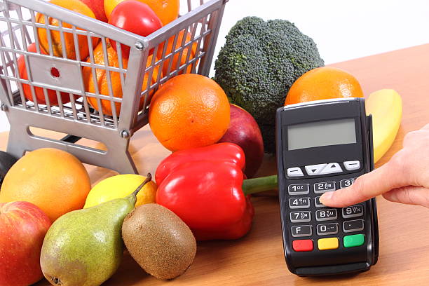 istock Using payment terminal, fruits and vegetables, cashless paying for shopping 520800254