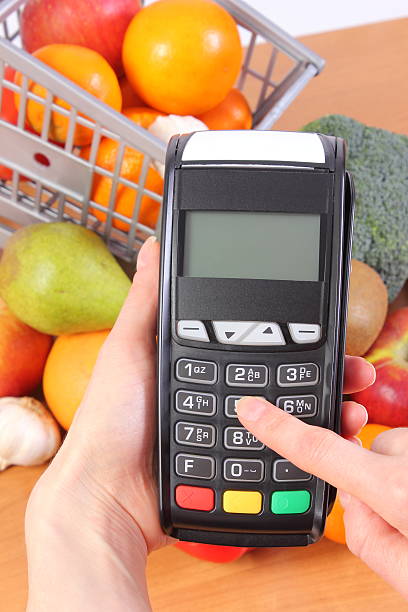 istock Using payment terminal, fruits and vegetables, cashless paying for shopping 520800628