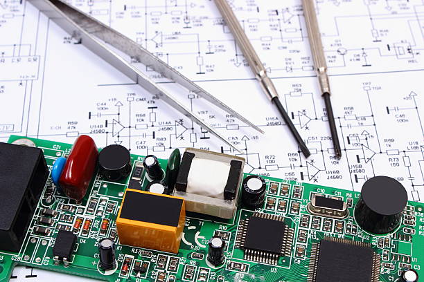 istock Printed circuit board and precision tools on diagram of electronics 520801142