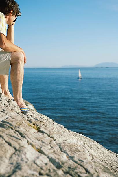 istock Man looking out over the ocean 520801650
