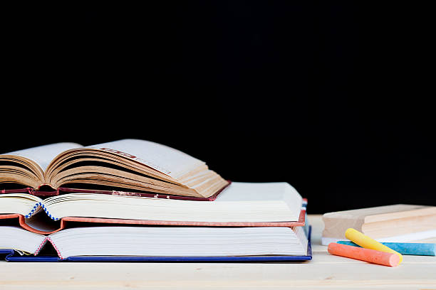 istock draft, books and chalk to blackboard background 520802750