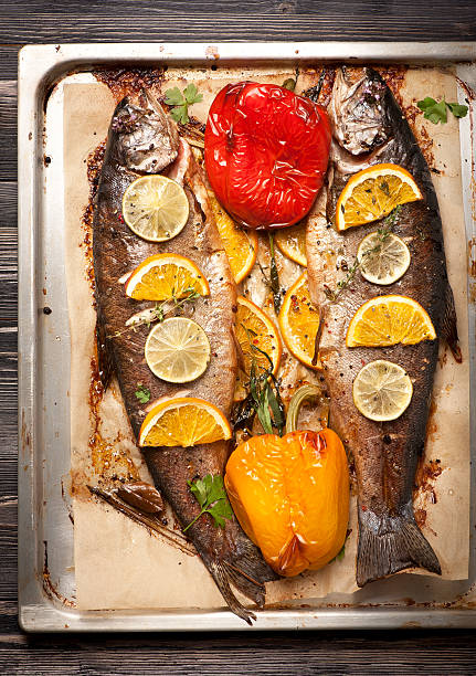 istock Trout fish baked with vegetables and herbs 520803649