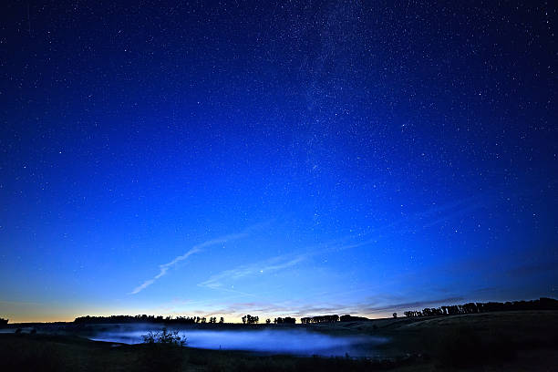 istock Dawn on a starry background sky and the Milky Way. 520804329