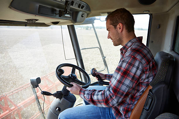 istock Farmer driving a combine harvester 520805267