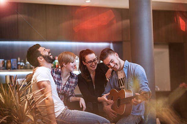 istock Friends having fun and relaxing evening 520805590