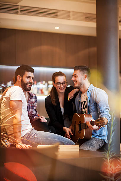 istock Friends having fun and relaxing evening 520805706