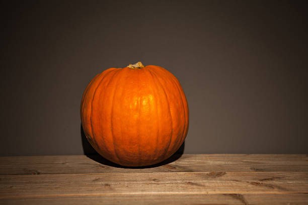 istock orange pumpkins wood 520806107