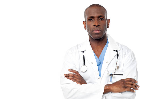 Male doctor posing  with arms crossed stock photo