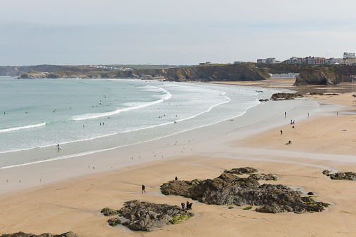 Newquay, Cornwall, England -October 5th 2014: Fine weather brought visitors to the beach to enjoy the late autumn sunshine at Newquay beach South West England on Sunday 5th October 2014