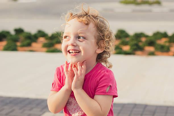 istock Cute baby girl having fun at a park 520808415