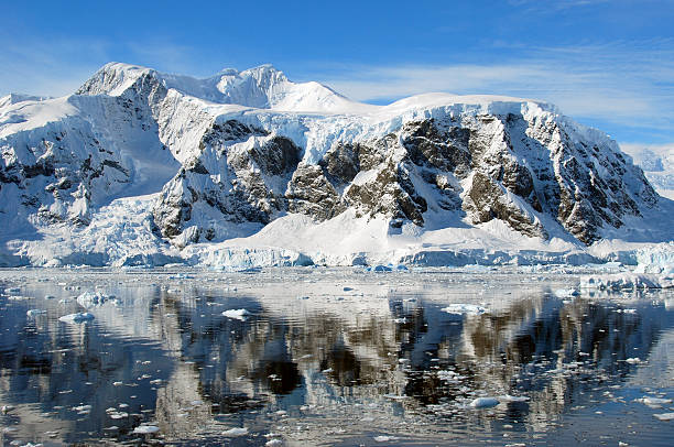 istock reflections of antarctic mountains 520808489