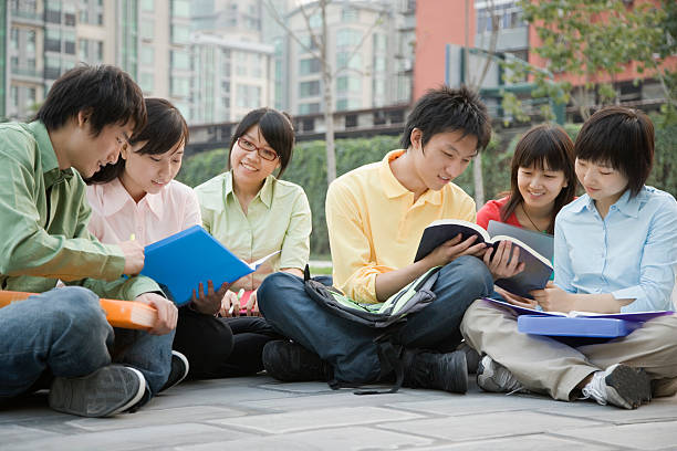 istock University students sitting together and discussing 520810497