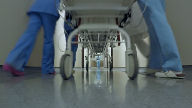 POV Patient on a stretcher being transported down the hospital hallway