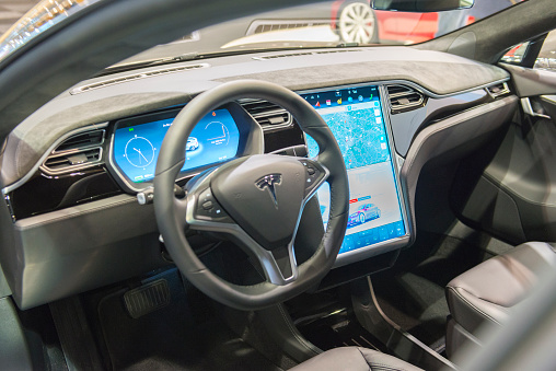 Brussels, Belgium - Januari 12, 2016: Luxurious interior on a Tesla Model S full electric luxury with a large touch screen and dashboard screen. The car is on display during the 2016 Brussels Motor Show.