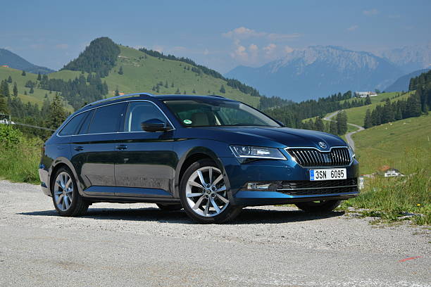 Munich, Germany, 2nd July, 2015: Skoda Superb Kombi stopped on the road during the test drive. The first generation of Superb was debut in 2001 on the market. The third generation of luxury liftback from Skoda is powered by diesel or petrol engines (pushing out 110-280 HP). The Superb is the most luxury car in Skoda offer.