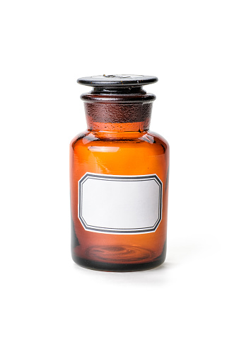 Apothecary bottle made of brown glass with empty label