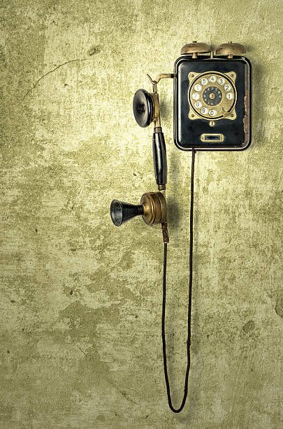 istock antique telephone on a grungy yellow wall 520832300