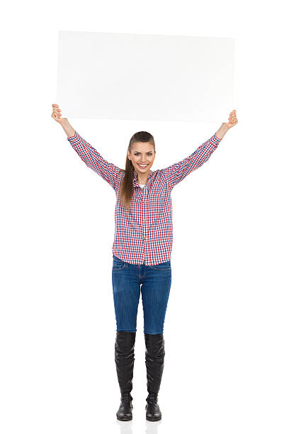 istock Casual Woman Holding Placard Above Her Head 520833696