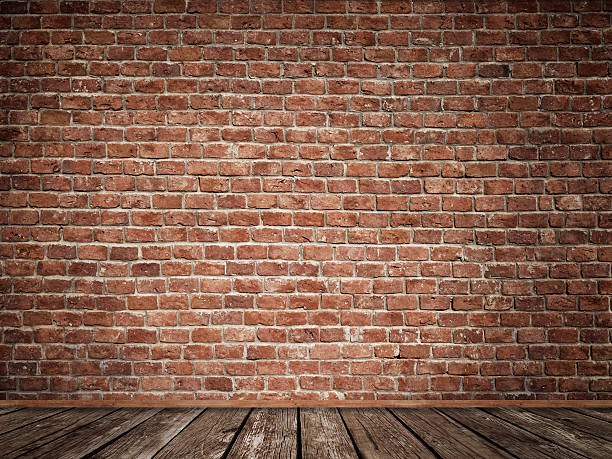 istock Old brick wall with old wooden floor. 520835408