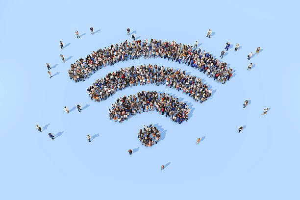 istock Group of people forming a wifi symbol 520835722
