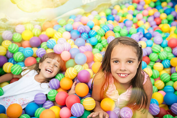 istock Girls in ball pool 520836208