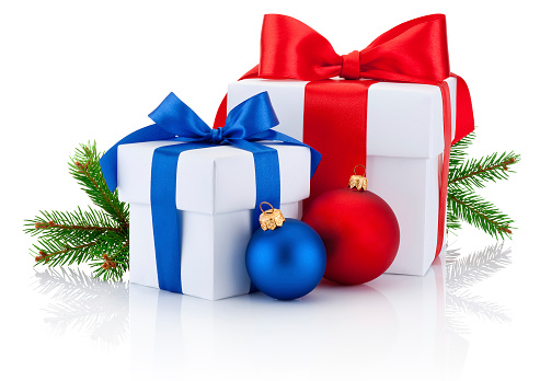 Two white boxs tied red and blue ribbon bow, pine tree branch and christmas balls Isolated on white background