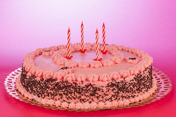 istock Birthday cake with unlit candles 520838525
