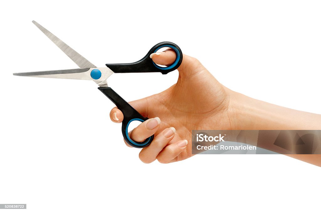 Scissors in female hand. Scissors in female hand isolated on white background. Close up, High resolution product Scissors Stock Photo