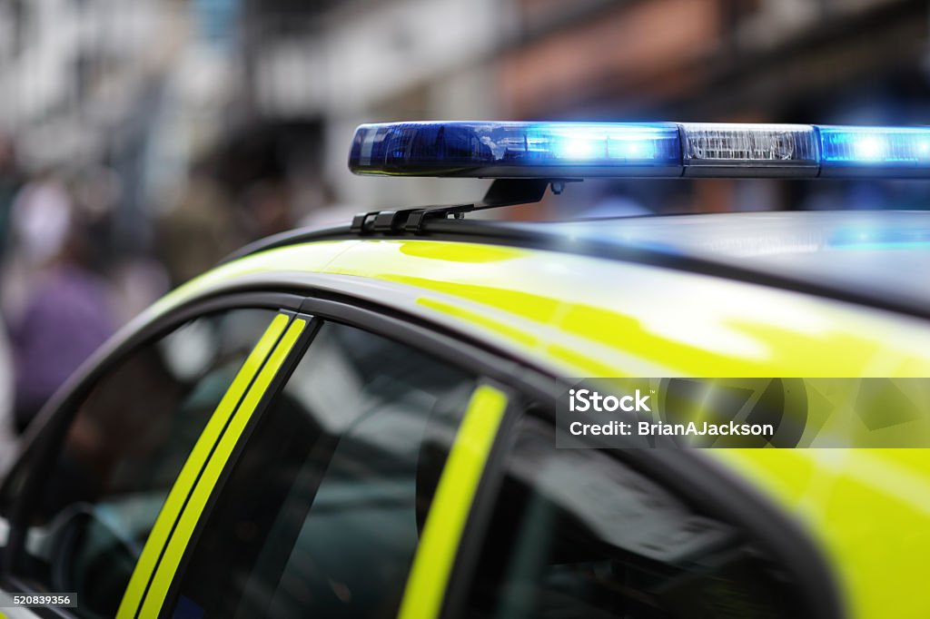 Police siren at accident or crime scene Police siren flashing blue lights at accident or crime scene Police Force Stock Photo