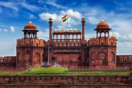 India famous travel tourist landmark and symbol - Red Fort (Lal Qila) Delhi with Indian flag - World Heritage Site. Delhi, India