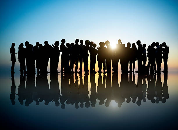 istock Group of Business People in Back Lit 520840369