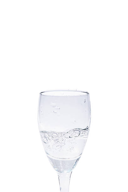 istock Close up water in wine glass, isolated on white background 520841662