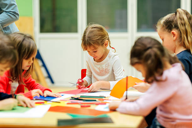 istock Happy Little Girl Having Creative Activity in kindergarten. 520841822