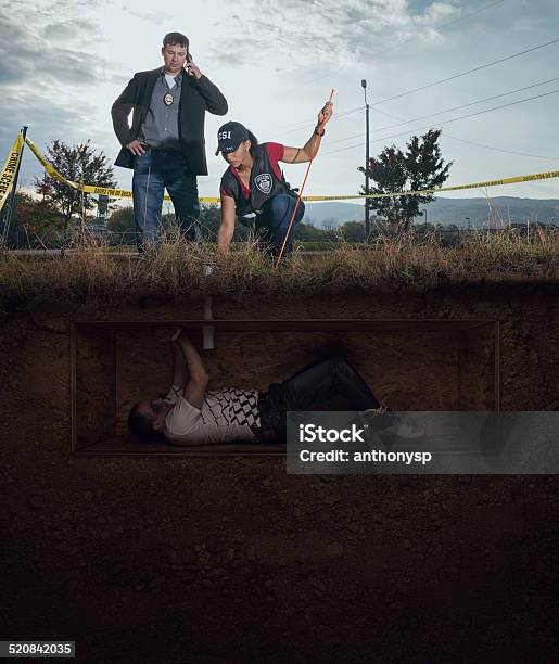 Csi Discovery Of A Male Victim Buried Alive Stock Photo - Download Image Now - African Ethnicity, Buried, Crime