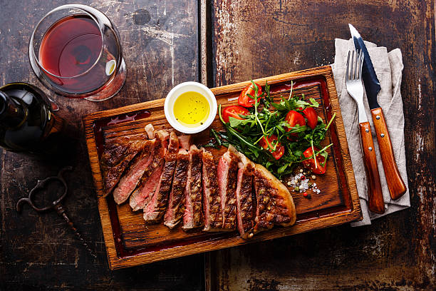 istock Sliced grilled steak and wine 520842138