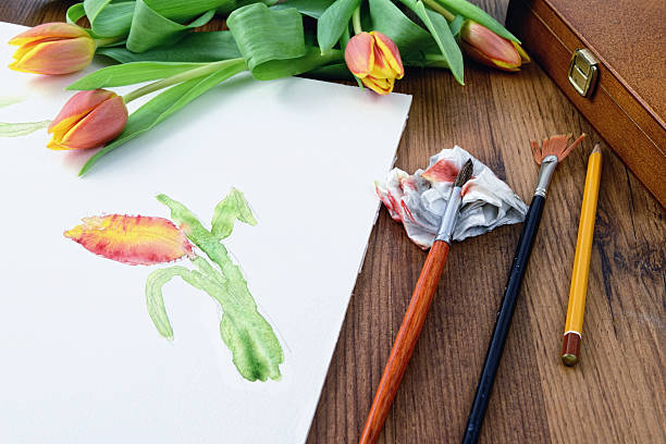 istock Painting tulip with water colours. paintbrusher aside 520842760
