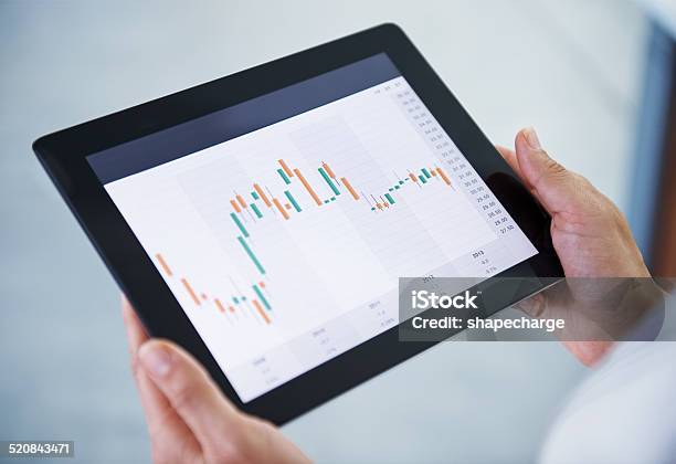 What Is Our Stock Doing Today Stock Photo - Download Image Now - Digital Tablet, Device Screen, Holding