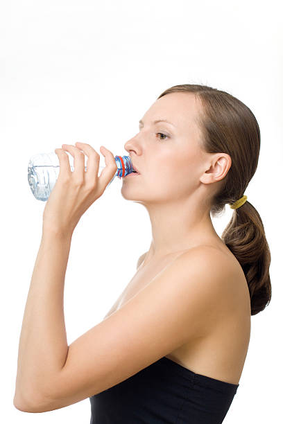 istock Beautiful woman drinking water 520843754