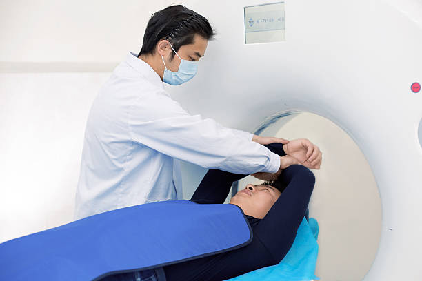 istock Radiologist with a patient at MRI scan 520843882